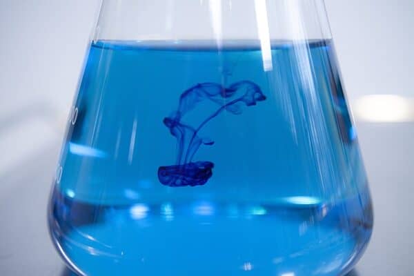 copper sulphate blue liquid in a glass jar