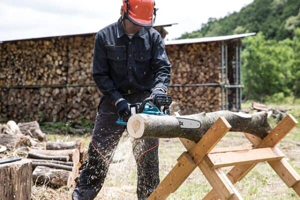 farmer using a chainsaw